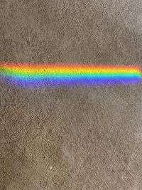 High angle view of rainbow over land