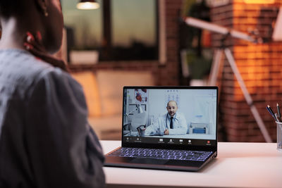 Man using laptop at table