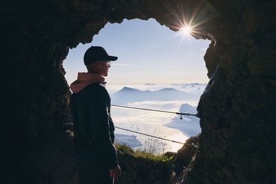 Rear view of young man looking at mountain