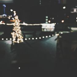 Defocused image of illuminated christmas tree at night