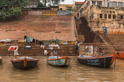 View of boats moored in canal