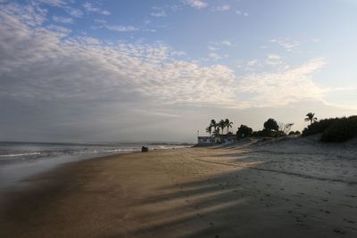 Scenic view of beach against sky during sunset