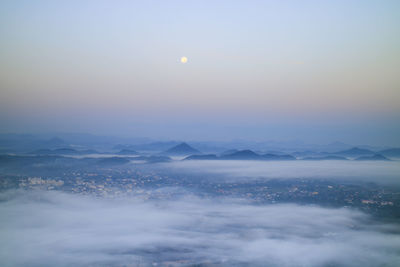 Scenic view of snowcapped mountains against sky during sunset