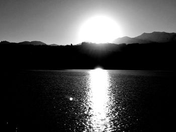 Scenic view of silhouette water against sky