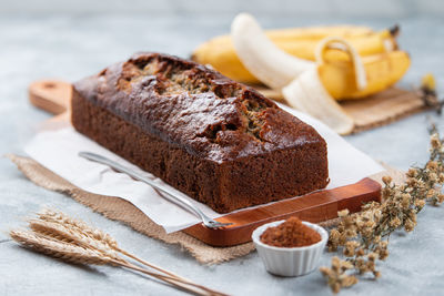 Close-up of cake on table,
a homemade banana cake on the wooden tray