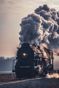 Train on railroad track against sky