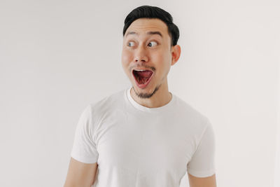 Portrait of mid adult man against white background