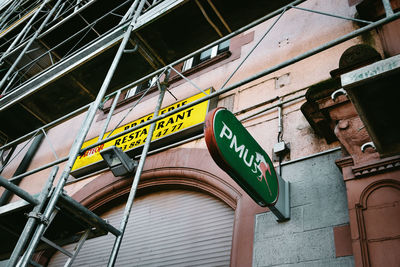 Low angle view of information sign on building