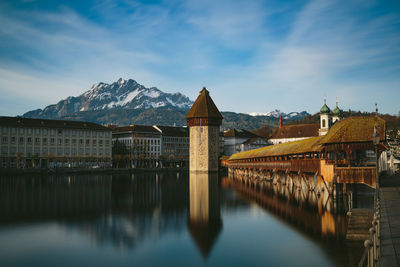 The chapel bridge in luzern city center, in the backgroud the alps.