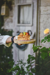 Cropped image of hand holding ice cream cone