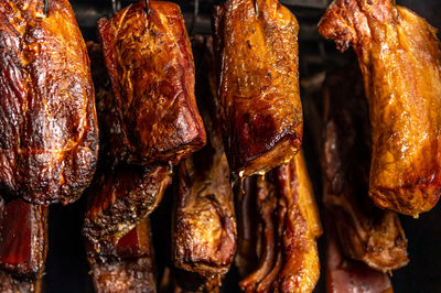 Smoked pork chop and sausages, in the smokehouse, food concept