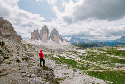 Rear view of man walking on mountain