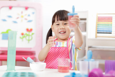 Young girl making ice lolly for homeschooling