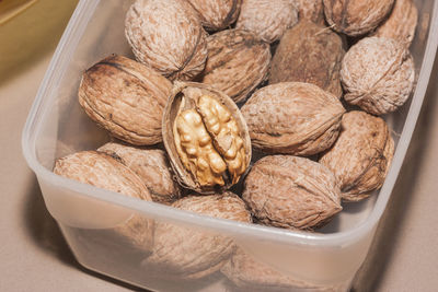 Walnuts in a clear plastic container