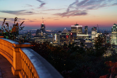 High angle view of illuminated buildings against sky during sunset