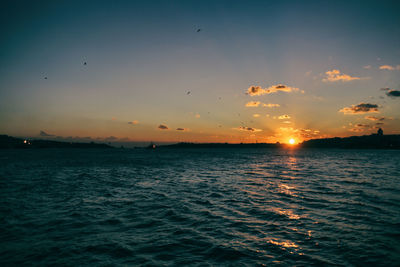 Scenic view of sea against sky during sunset