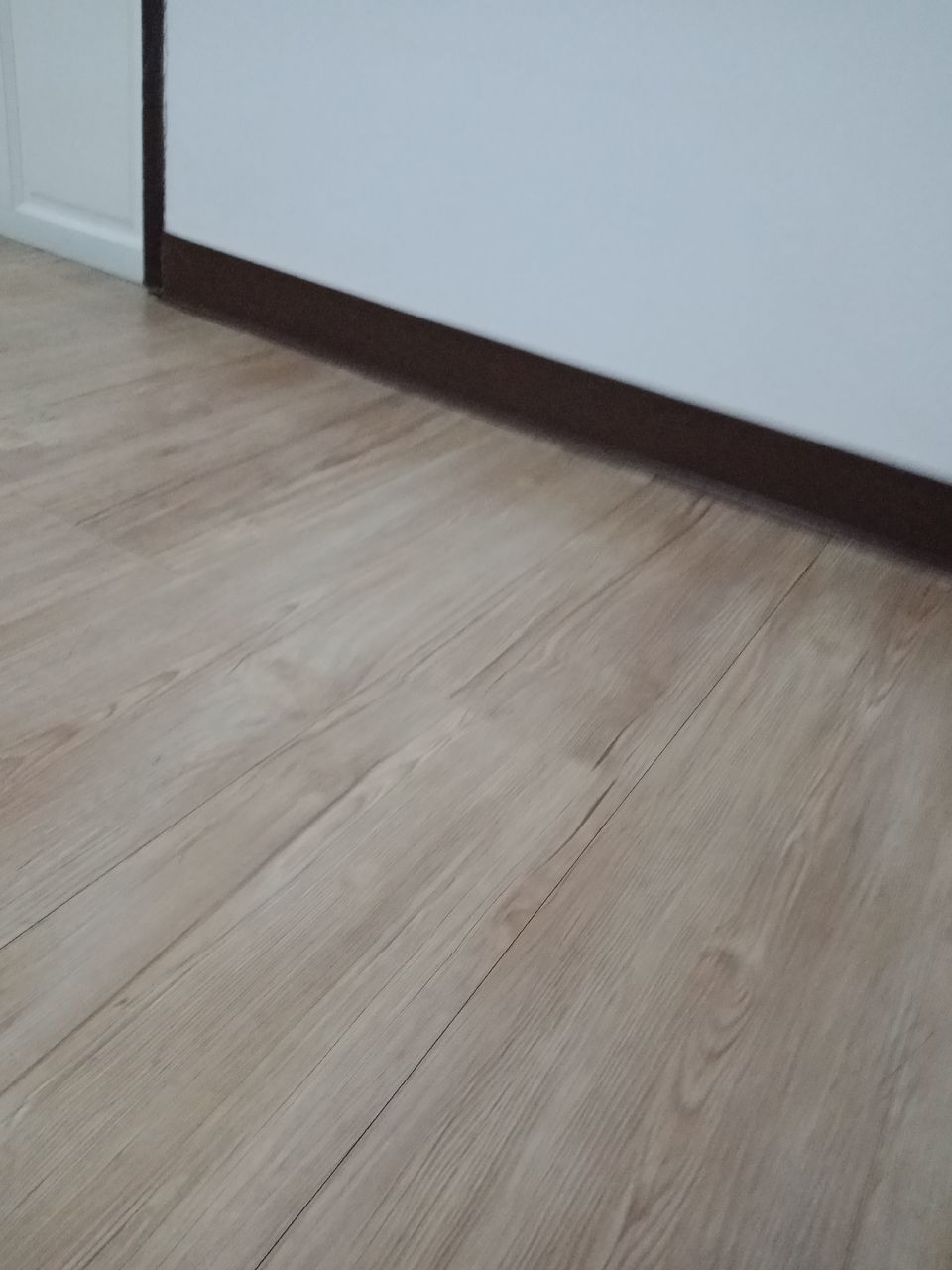 HIGH ANGLE VIEW OF WOODEN TABLE ON HARDWOOD FLOOR