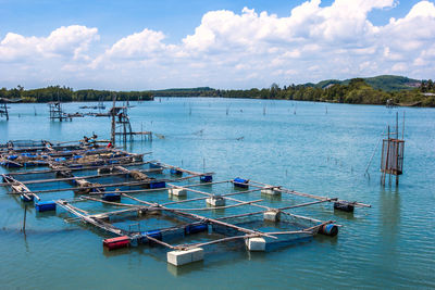 Boats moored at harbor