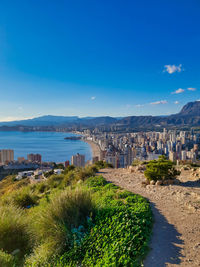 Scenic view of sea against blue sky