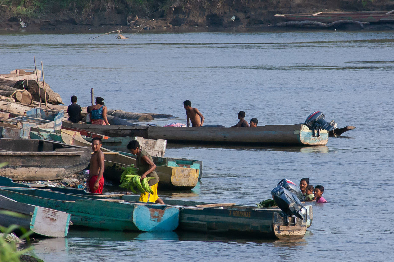 GROUP OF PEOPLE ON BOAT IN SEA