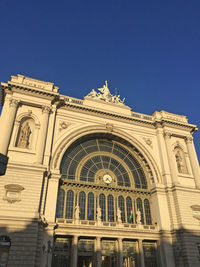 Low angle view of church against blue sky