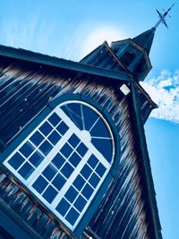 Low angle view of clock tower against sky