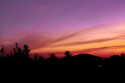 Scenic view of silhouette landscape against romantic sky at sunset