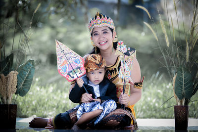 Portrait of smiling woman with umbrella