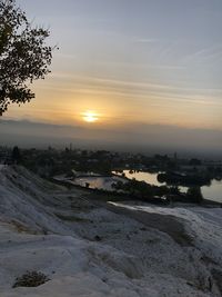 Scenic view of landscape against sky during sunset