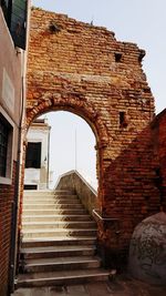 Low angle view of staircase against old building