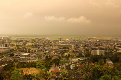 Aerial view of town against sky