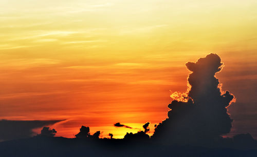Low angle view of silhouette rock against sky during sunset