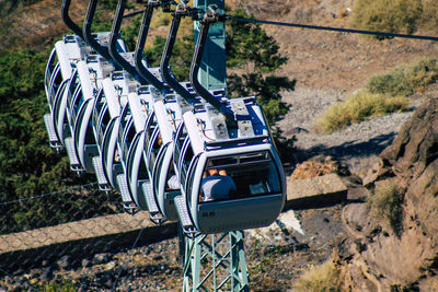 High angle view of bicycle hanging on railing