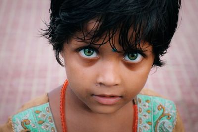 High angle portrait of cute girl with green eyes