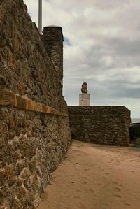 Old ruin building against cloudy sky