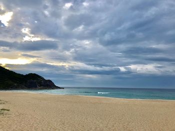 Scenic view of beach against sky