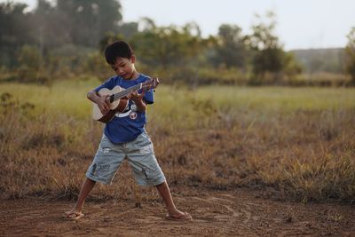 Boy playing on field