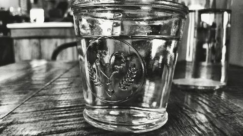 Close-up of glass jar on table