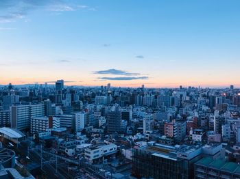 High angle view of buildings against sky during sunset