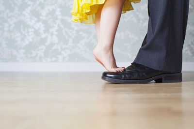 Low section of women standing on floor