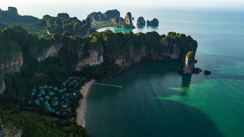 High angle view of rocks on sea against sky