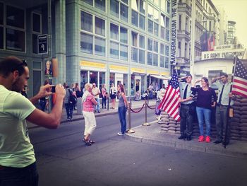 Woman standing on city street