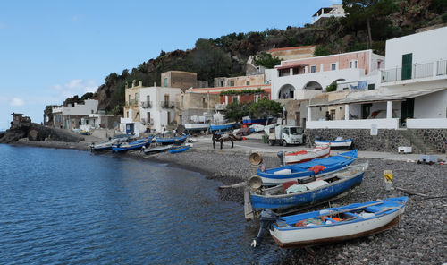 Boats moored at harbor