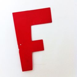 Close-up of red rose over white background