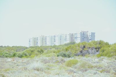 Modern cityscape against clear sky