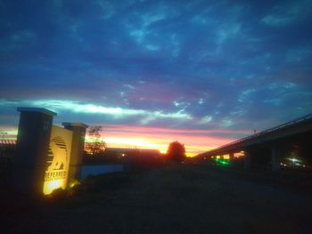 Buildings in city at sunset