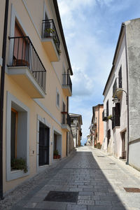 A narrow street between the houses of ruviano, a small village in the province of caserta in italy.