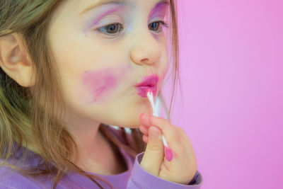 Portrait of cute girl with pink eyes