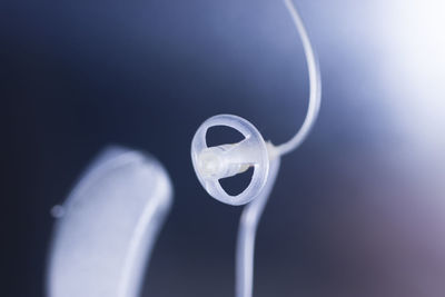 Close-up of electric lamp against blue background