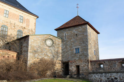 Low angle view of old building against sky